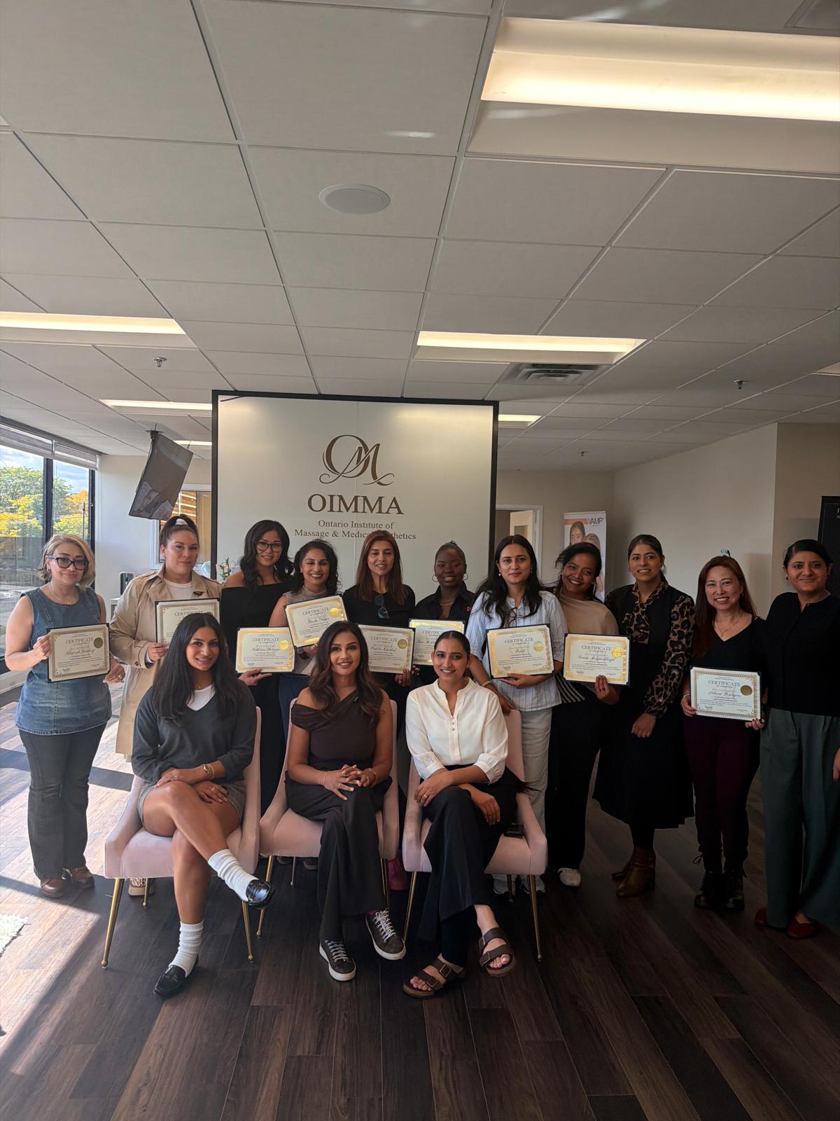 OIMMA graduates celebrating their certificates
