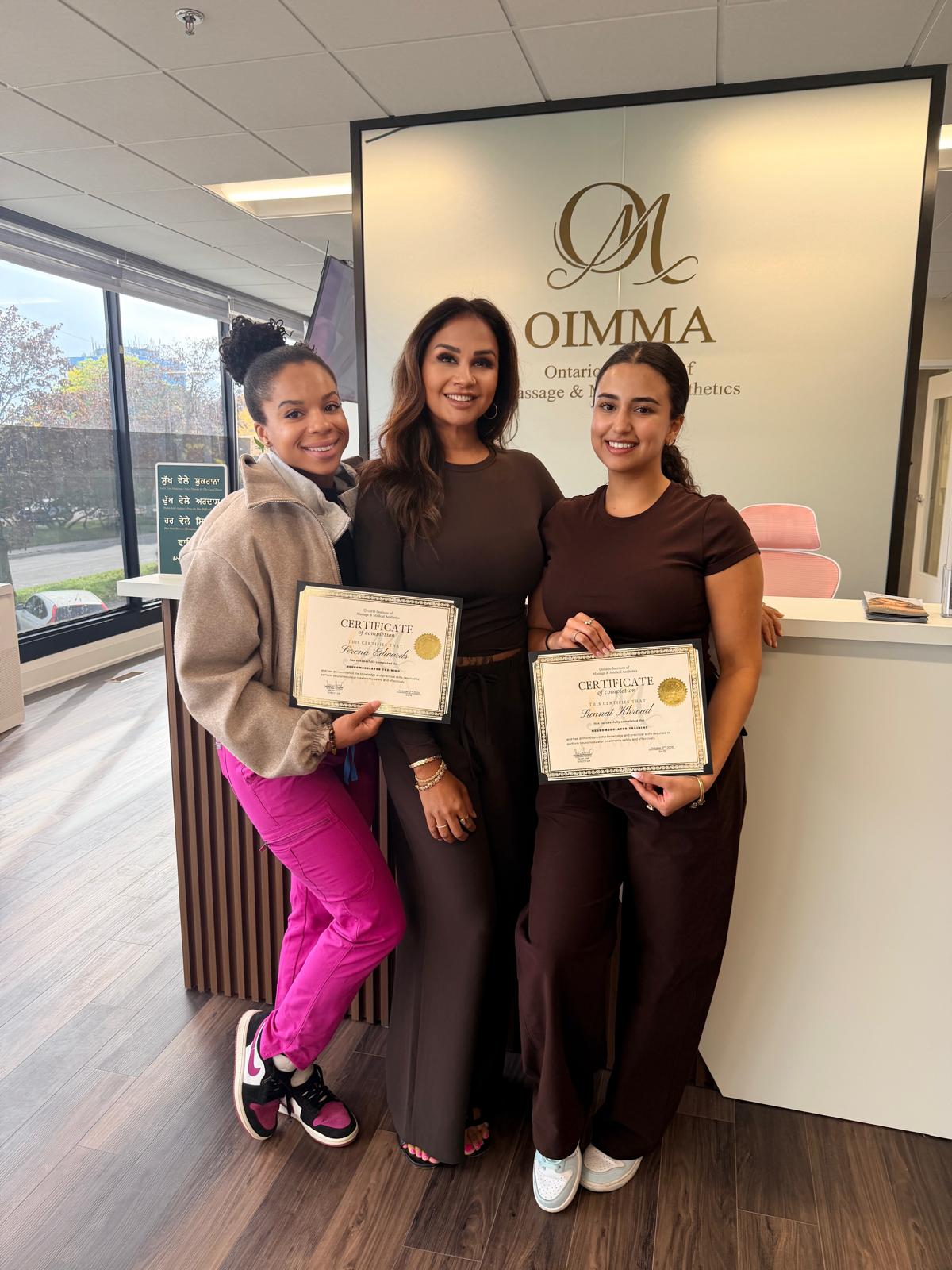 Students with their certificates at OIMMA
