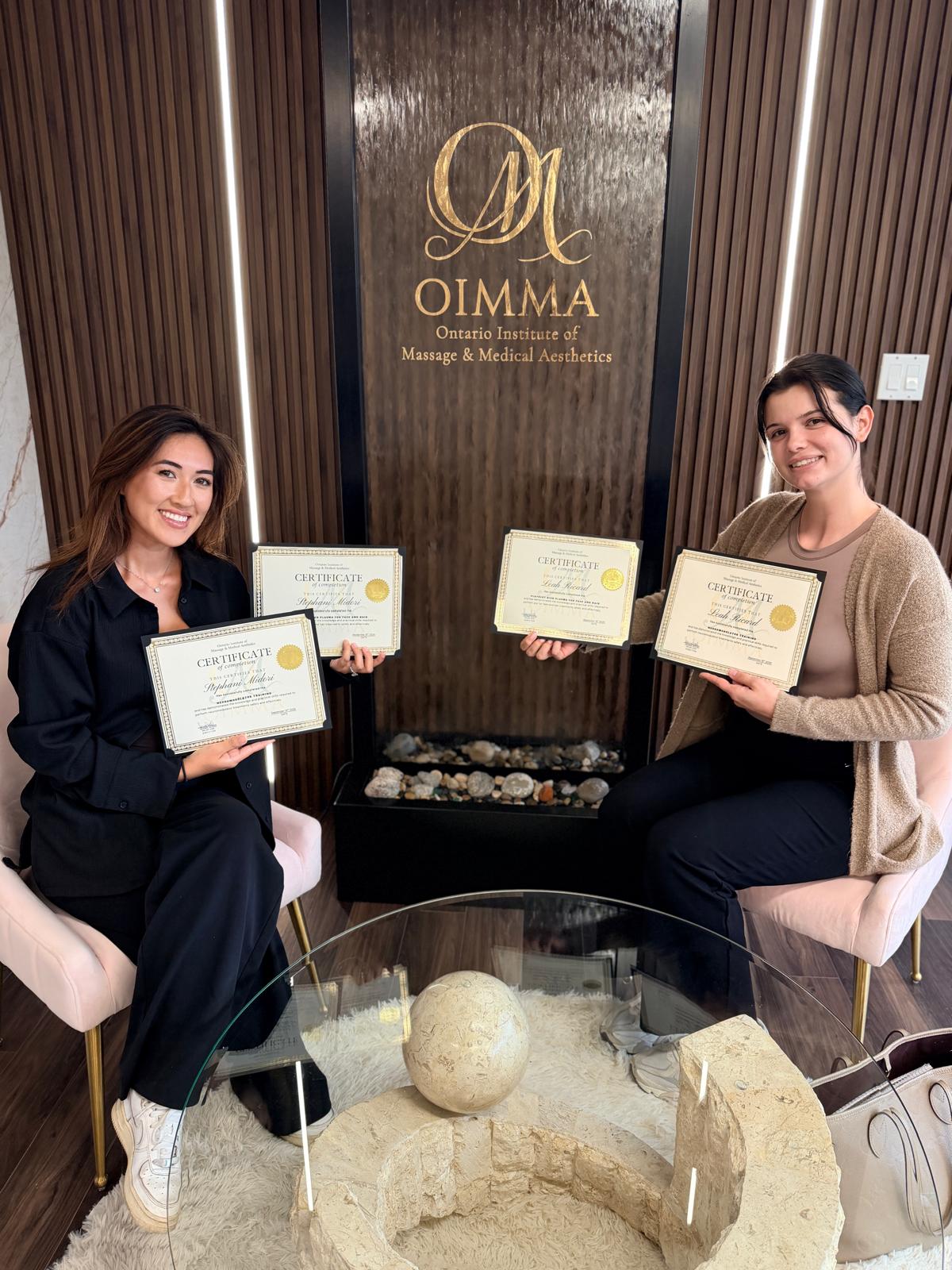 OIMMA graduates sharing a class milestone