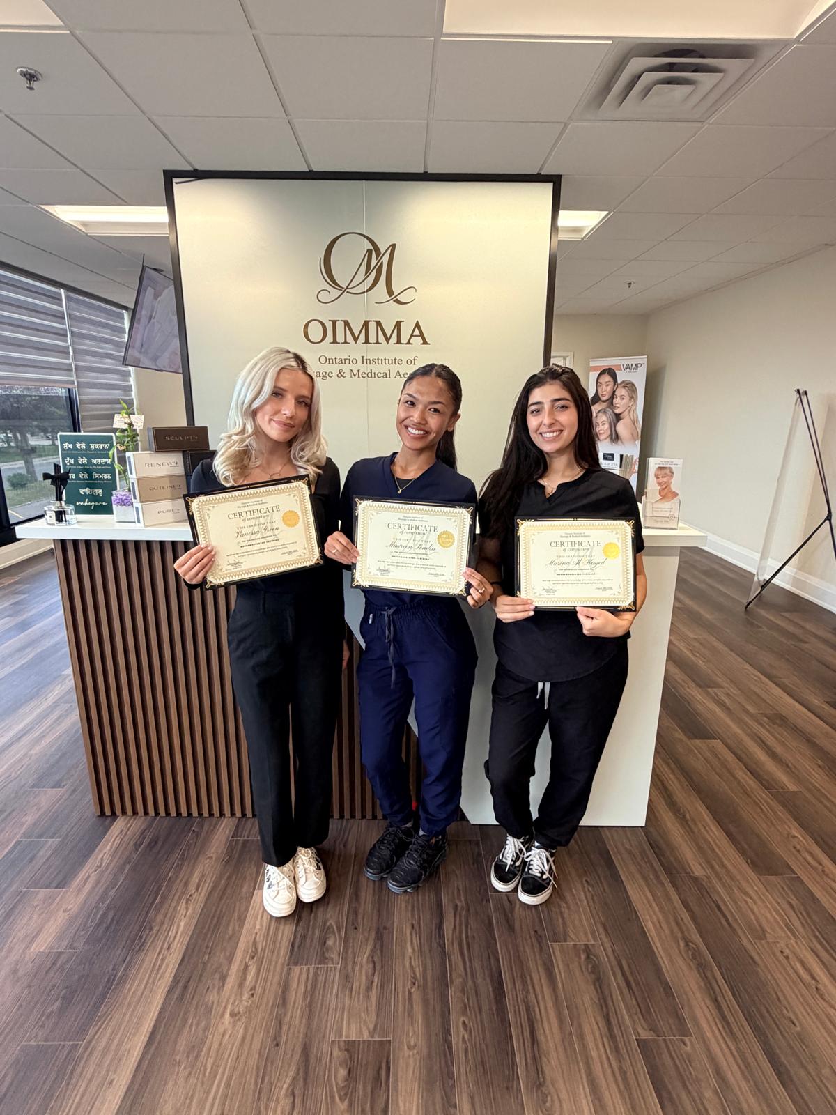 Students celebrating their OIMMA training
