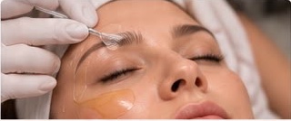 Chemical peel treatment being demonstrated